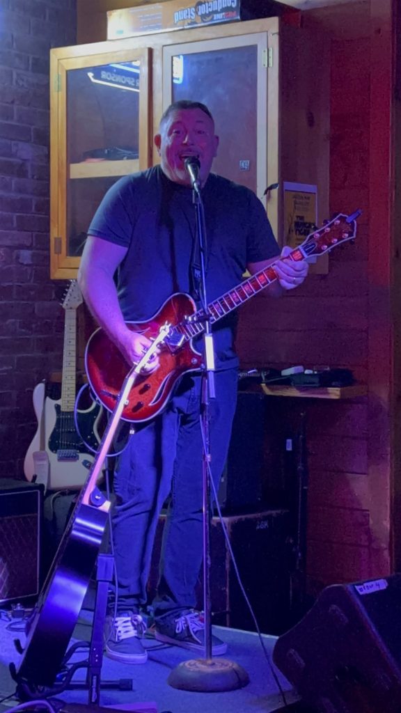 Dennis performing live